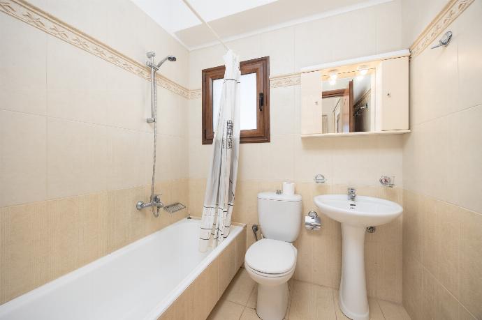 En suite bathroom with bath and shower . - Villa Nikolas . (Photo Gallery) }}