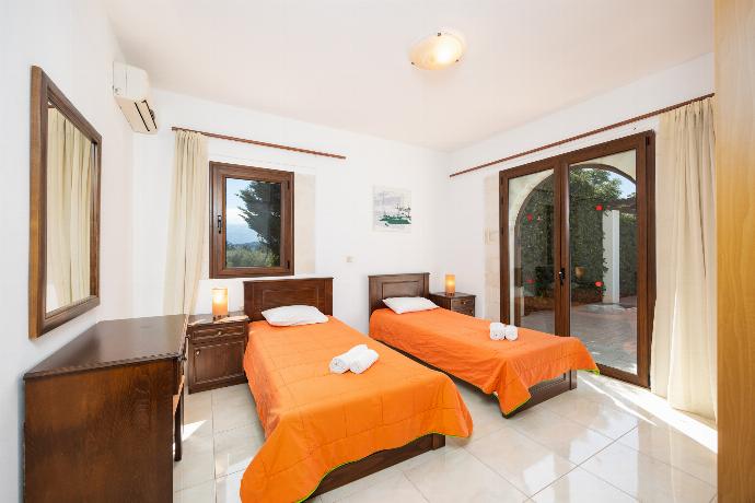 Twin bedroom with A/C . - Villa Nikolas . (Photo Gallery) }}