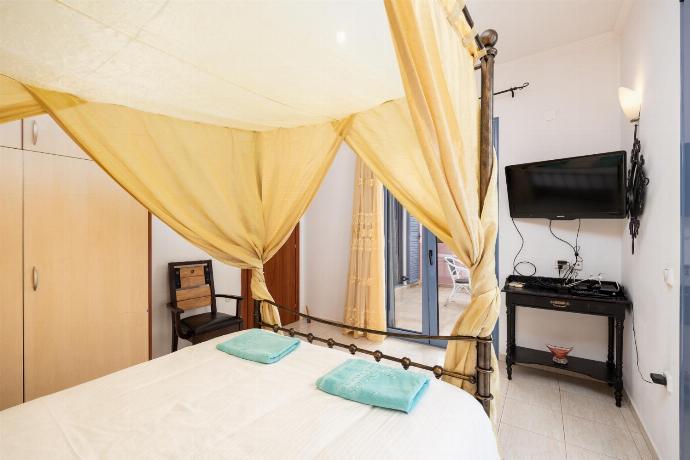 Double bedroom with A/C and TV . - Villa Nisyros . (Photo Gallery) }}