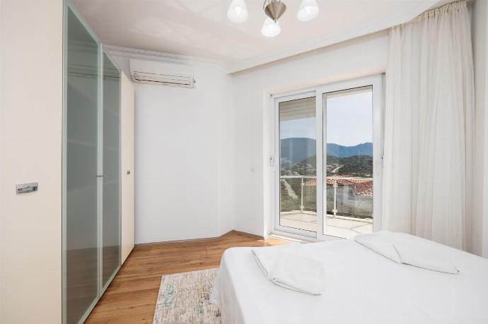 Double bedroom with A/C and sea views . - Villa Erdem . (Photo Gallery) }}