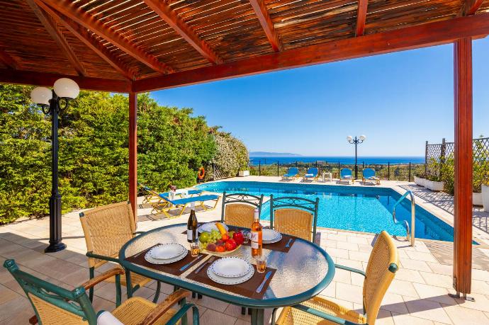 Sheltered terrace area with sea views . - Villa Thalia Katerina . (Photo Gallery) }}