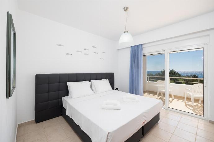 Double bedroom with A/C, TV, and sea views . - Villa Mediterranean Blue . (Photo Gallery) }}