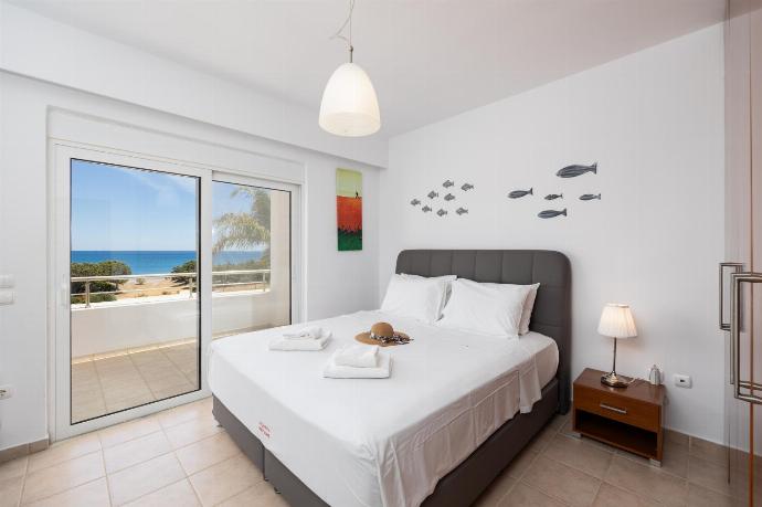 Main building: double bedroom with A/C, TV, and sea views . - Villa Pelagos Blue . (Photo Gallery) }}