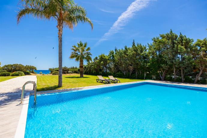 Private pool, terrace, and garden with sea views . - Villa Pelagos Blue . (Photo Gallery) }}