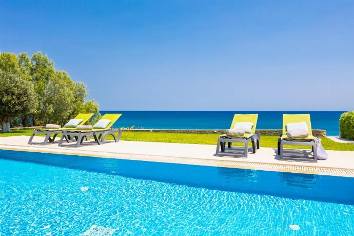 Private pool, terrace, and garden with sea views . - Villa Lahania . (Photo Gallery) }}