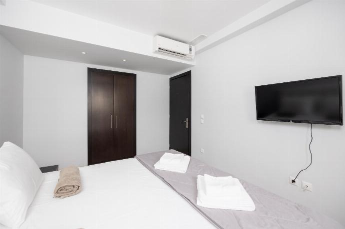 Double bedroom with A/C and TV . - Villa Tsampikos . (Photo Gallery) }}