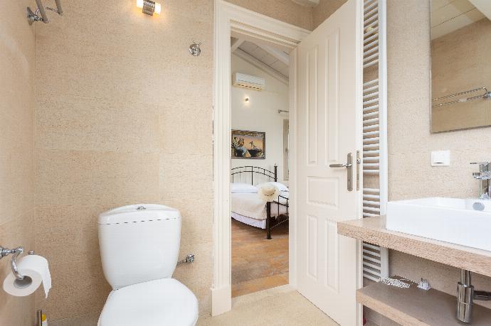 En suite bathroom with bath and shower . - Villa Levanda . (Photo Gallery) }}