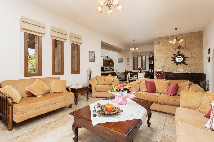 Open-plan living room on ground floor with sofas, dining area, kitchen, ornamental fireplace, A/C, WiFi internet, satellite TV, and sea views . - Villa Erato . (Photo Gallery) }}