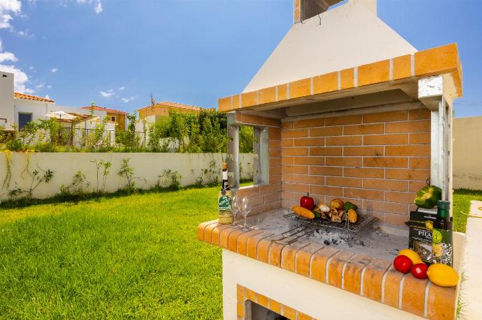 Garden area with BBQ . - Villa Petra . (Photo Gallery) }}