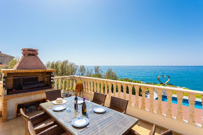Terrace area with BBQ and sea views . - Villa Beach Heaven . (Photo Gallery) }}