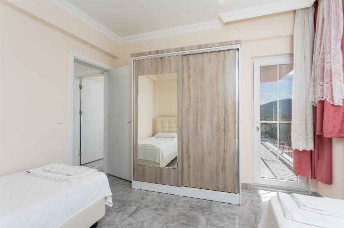 Twin bedroom with A/C and balcony access . - Villa Corals . (Photo Gallery) }}