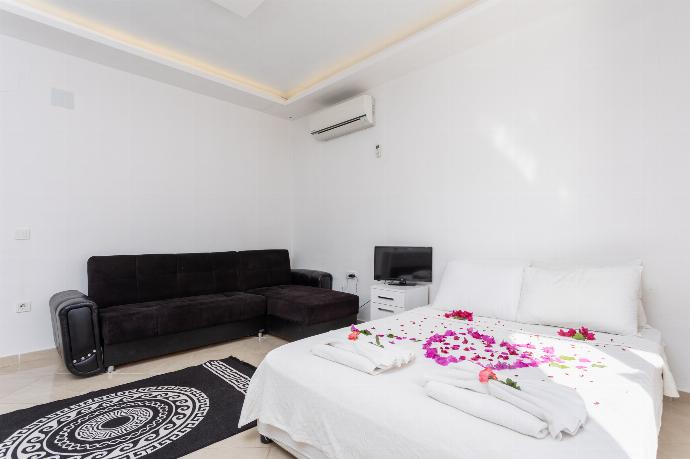 Double bedroom with A/C, kitchenette, sofa, and TV . - Villa Casa Mia . (Photo Gallery) }}