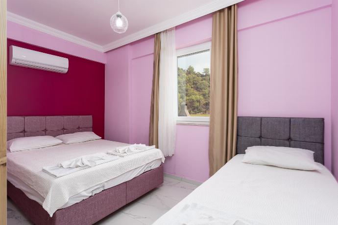 Bedroom with double bed and single bed, and A/C . - Villa Sasha 1 . (Photo Gallery) }}