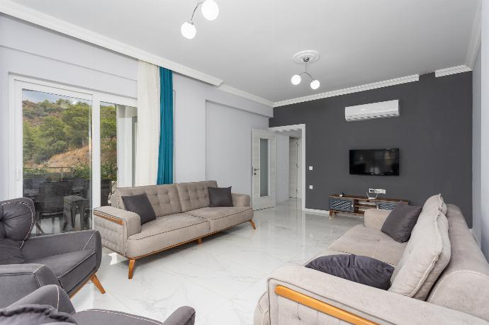 Living room with sofas, A/C, WiFi internet, and satellite TV . - Villa Sasha 2 . (Photo Gallery) }}