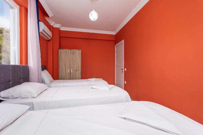 Bedroom with three single beds, and A/C . - Villa Sasha 2 . (Photo Gallery) }}