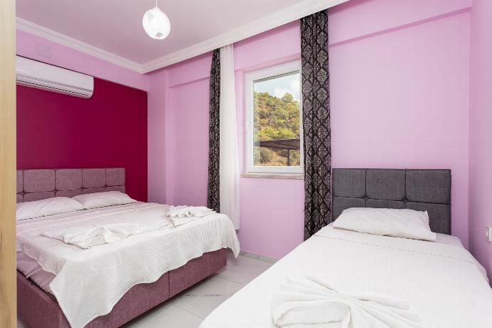 Bedroom with double bed, single bed, and A/C . - Villa Sasha 2 . (Photo Gallery) }}