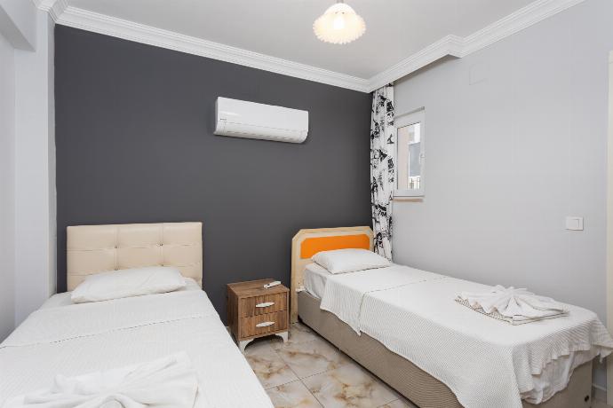 Twin bedroom with en suite bathroom and A/C . - Villa Ada 1	 . (Photo Gallery) }}