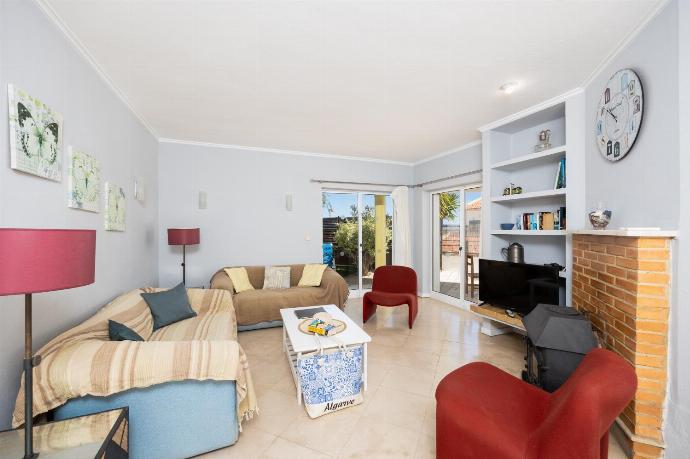 Living room with sofas, dining area, ornamental fireplace, WiFi internet, and satellite TV . - Villa Brejos . (Fotogalerie) }}