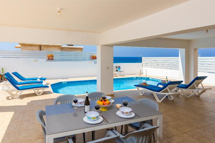 Sheltered terrace area with sea views . - Villa Serena . (Photo Gallery) }}