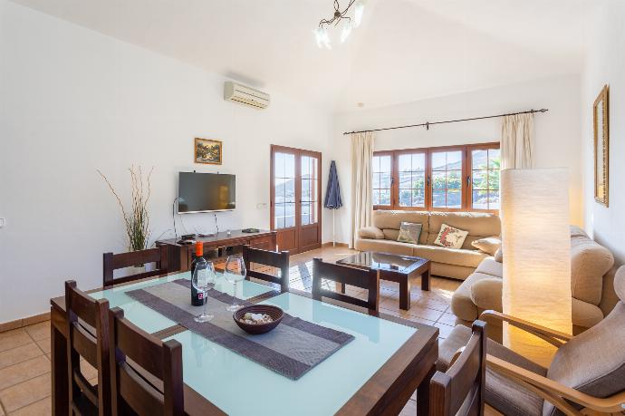 Living room with sofas, dining area, A/C, WiFi internet, and satellite TV . - Villa El Callao . (Photo Gallery) }}