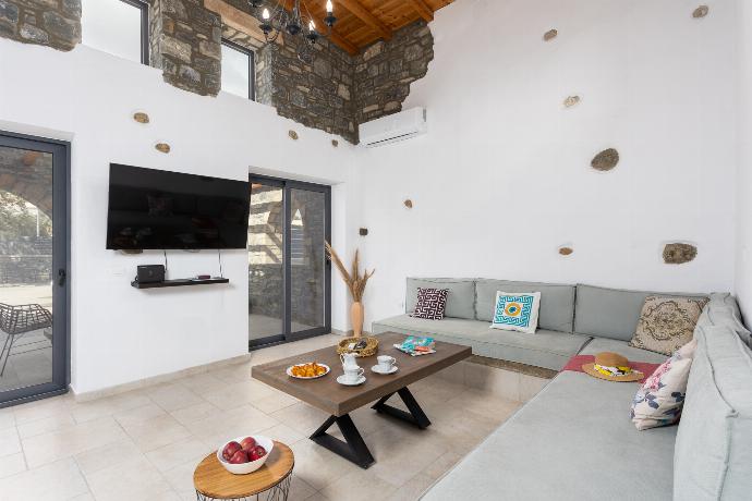 Open-plan living room with sofa, dining area, kitchen, mezzanine, A/C, WiFi internet, and satellite TV . - La Casa Di Pietre 1 . (Photo Gallery) }}