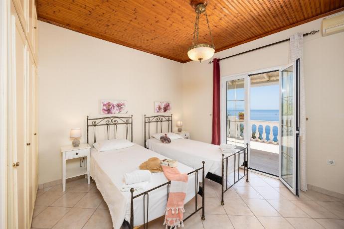 Twin bedroom with A/C and sea views . - Villa Theodora . (Photo Gallery) }}