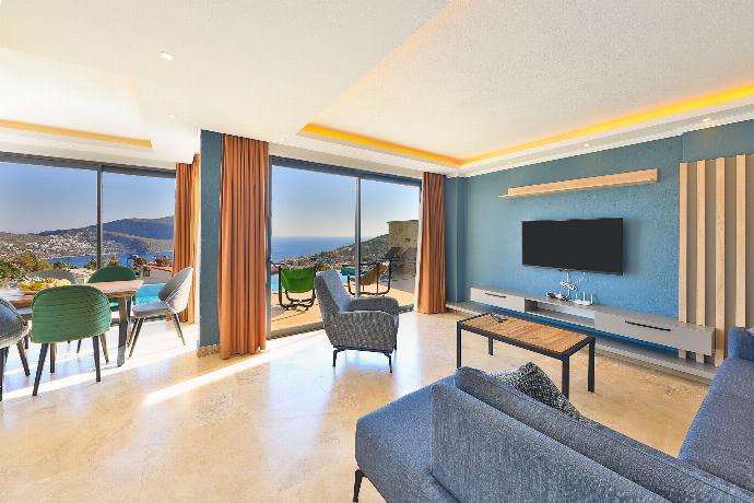 Open-plan living room with sofas, dining areas, WiFi internet, satellite TV, and terrace access with panoramic sea views . - Villa Ardic . (Photo Gallery) }}