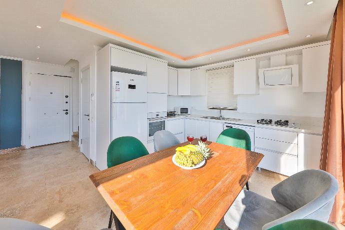 Equipped kitchen with dining area . - Villa Ardic . (Photo Gallery) }}