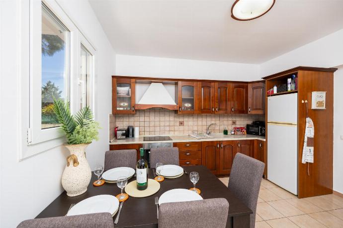 Equipped kitchen with dining area . - Villa Afrodite Classico . (Photo Gallery) }}