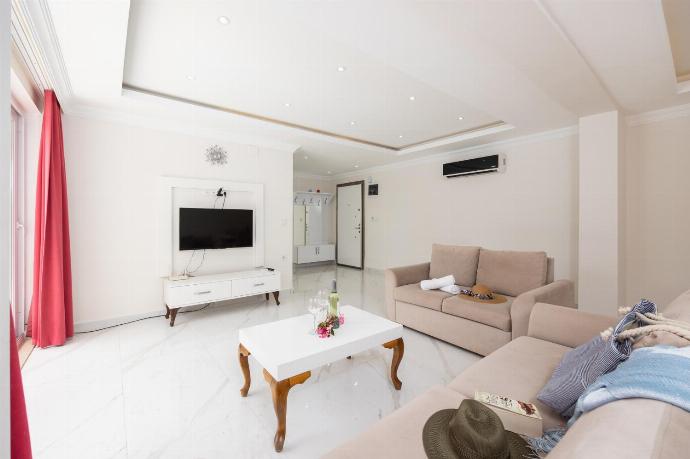 Living room with sofas, dining area, A/C, WiFi internet, and satellite TV . - Villa Premium F . (Photo Gallery) }}