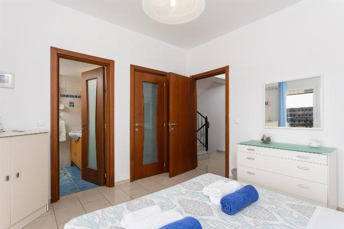 Double bedroom with en suite bathroom, A/C, and balcony access . - Amphitrite Villa . (Photo Gallery) }}