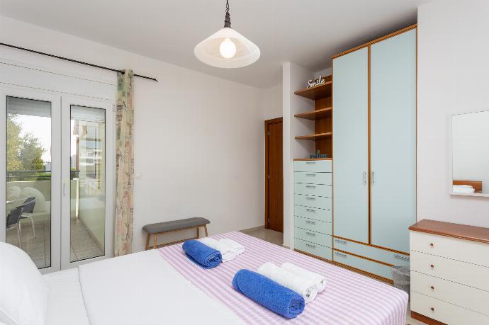 Double bedroom with A/C and balcony access . - Amphitrite Villa . (Photo Gallery) }}