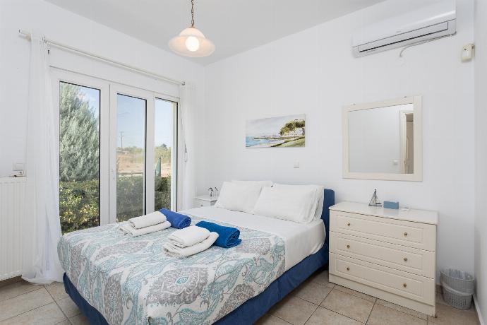 Double bedroom with A/C . - Hermione Villa . (Photo Gallery) }}