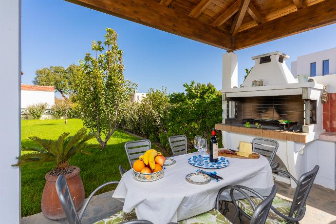 Sheltered terrace area with BBQ . - Hermione Villa . (Photo Gallery) }}