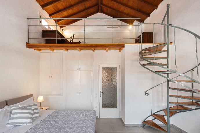 Double bedroom with A/C and loft . - Esperos Apartment . (Photo Gallery) }}