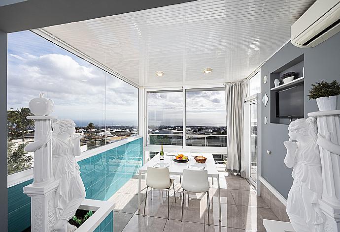Dining area with A/C, TV, and sea views . - Casa Marina . (Photo Gallery) }}