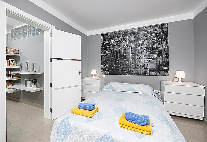 Double bedroom with A/C, sofa, and TV . - Casa Marina . (Photo Gallery) }}