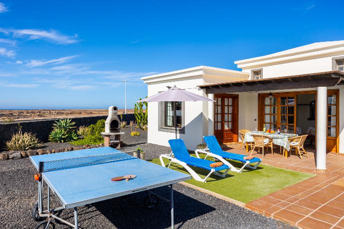 Terrace area with table tennis . - Villa Capricho . (Photo Gallery) }}