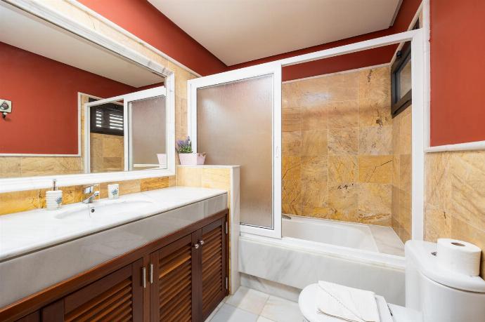 En suite bathroom with bath and shower . - Villa Capricho . (Photo Gallery) }}
