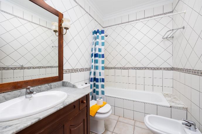 En suite bathroom with bath and shower . - Villa Florencia . (Photo Gallery) }}