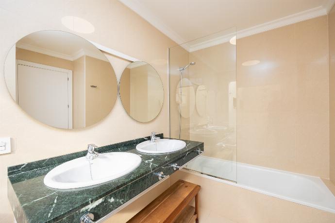 En suite bathroom with bath and shower . - Villa Saona . (Photo Gallery) }}