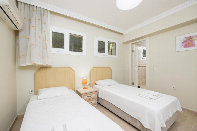 Twin bedroom with en suite bathroom and A/C . - Golden Trio Villa . (Photo Gallery) }}