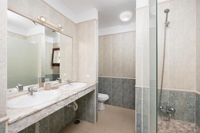 En suite bathroom with shower . - Villa Salar . (Photo Gallery) }}