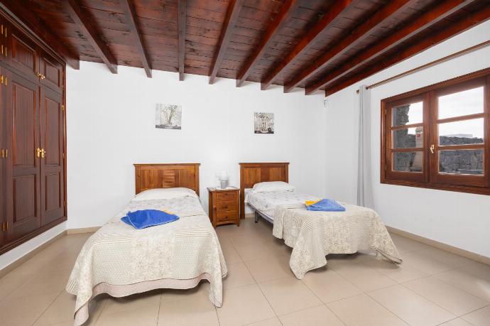 Twin bedroom with A/C . - Villa Salar . (Photo Gallery) }}