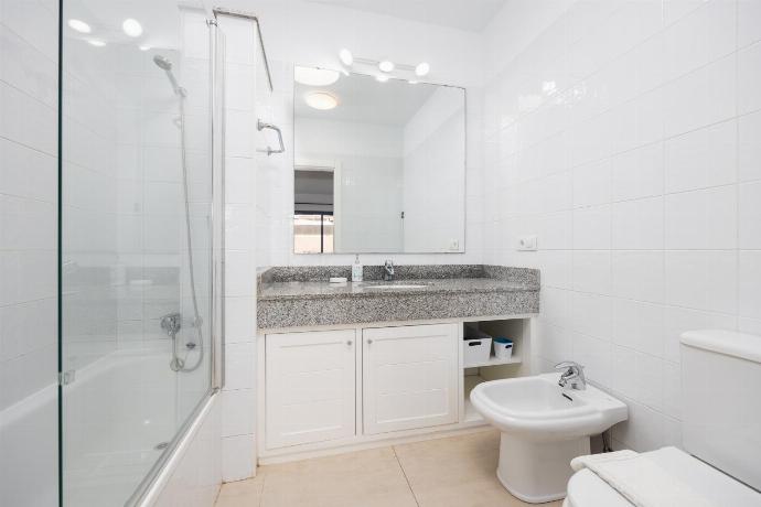 Family bathroom with bath and shower . - Villa Beyond . (Photo Gallery) }}