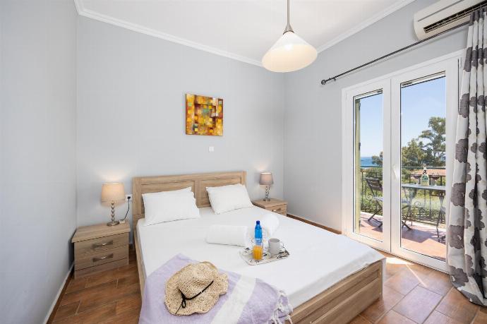 Double bedroom with A/C . - Villa Kostis . (Photo Gallery) }}