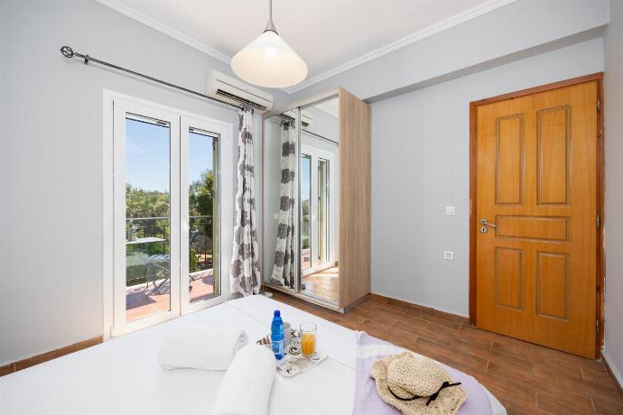 Double bedroom with A/C . - Villa Kostis . (Photo Gallery) }}