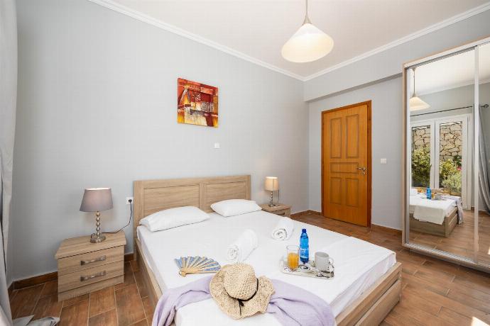 Double bedroom with A/C . - Villa Kostis . (Photo Gallery) }}