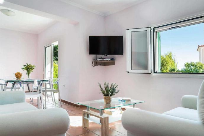 Open plan living room with TV, WiFi, dining area, comfortable sofas . - Villa Olga . (Photo Gallery) }}