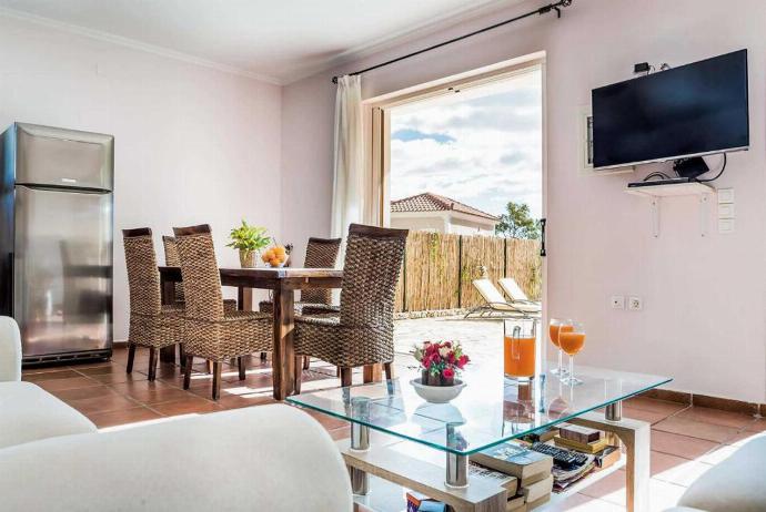 Open plan living room with TV, WiFi, comfortable sofas, dining area, patio doors . - Villa Alex . (Photo Gallery) }}